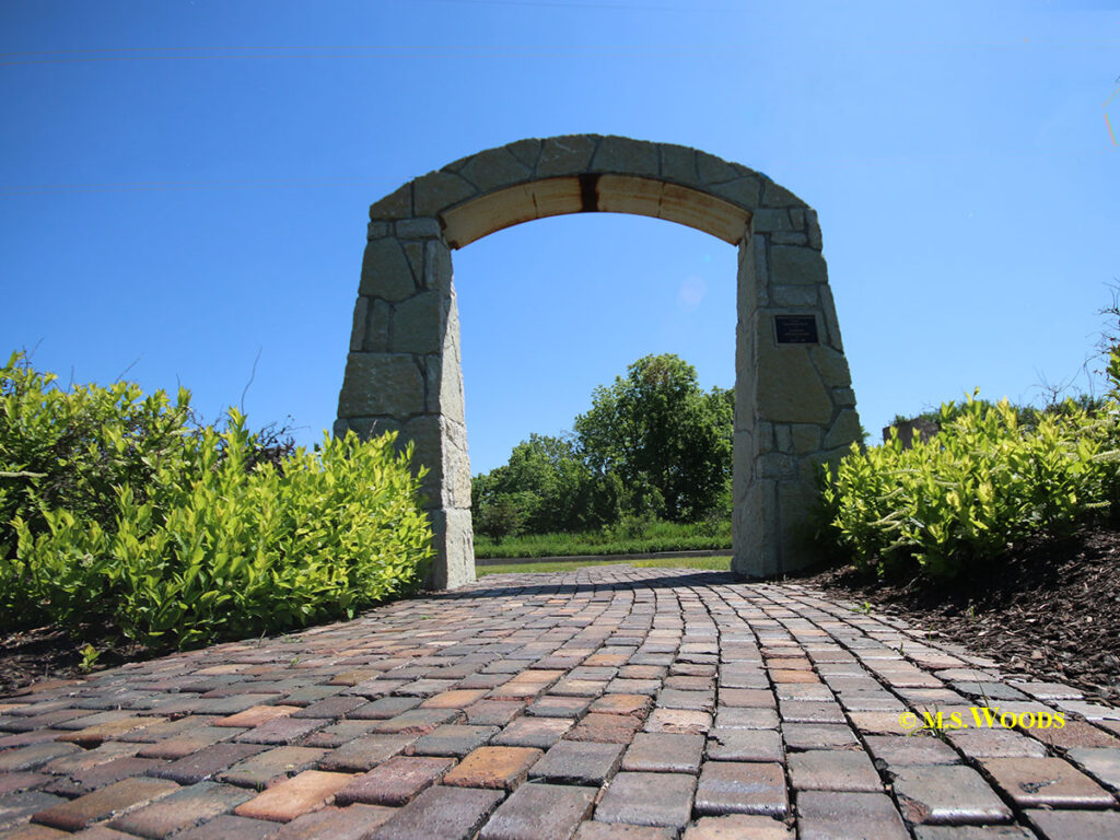 Archway entray over brick walk at the American Legion Trail Crossing in Zionsville, Indiana