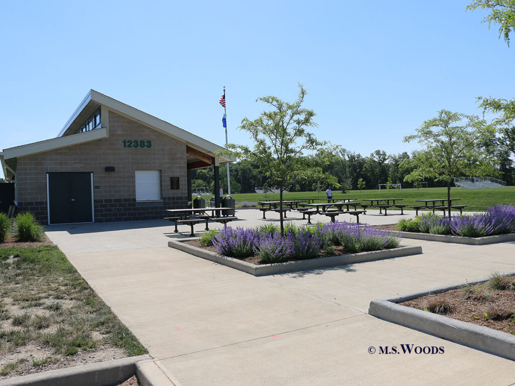 Picnic tables, gardens and service building at Cyntheanne Park in Fishers, Indiana