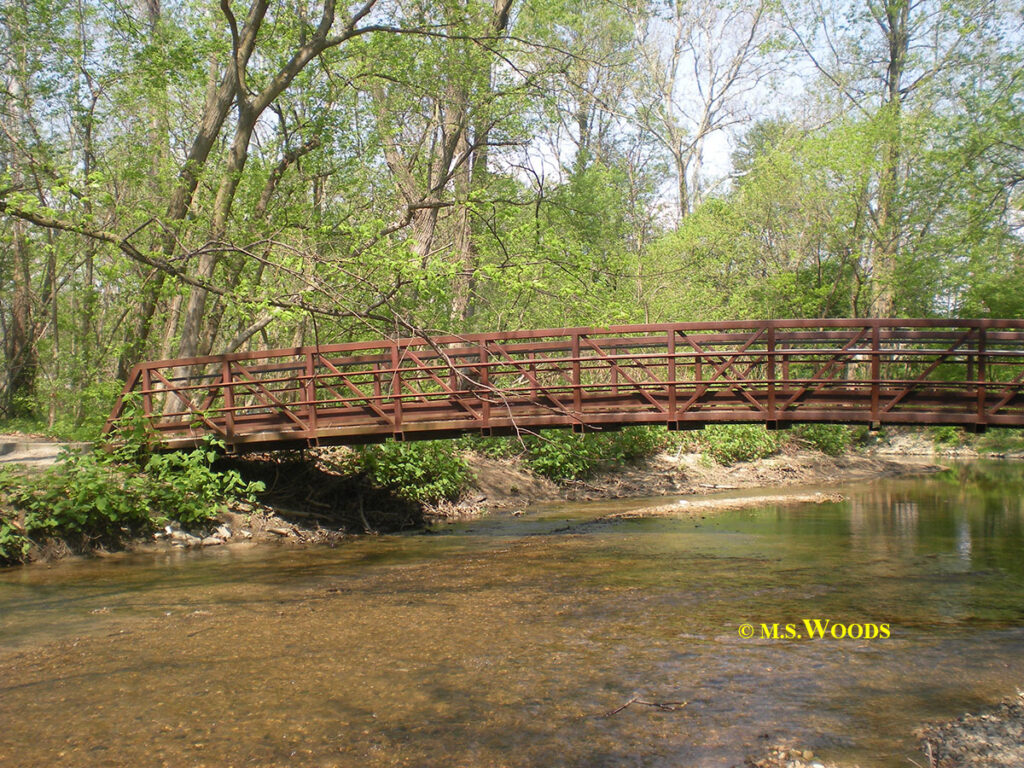 Foot bridge over creek at the Flowing Well Park in Carmel, Indiana