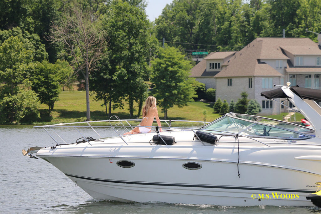 Woman on a boat at Geist Lake in Fishers, Indiana