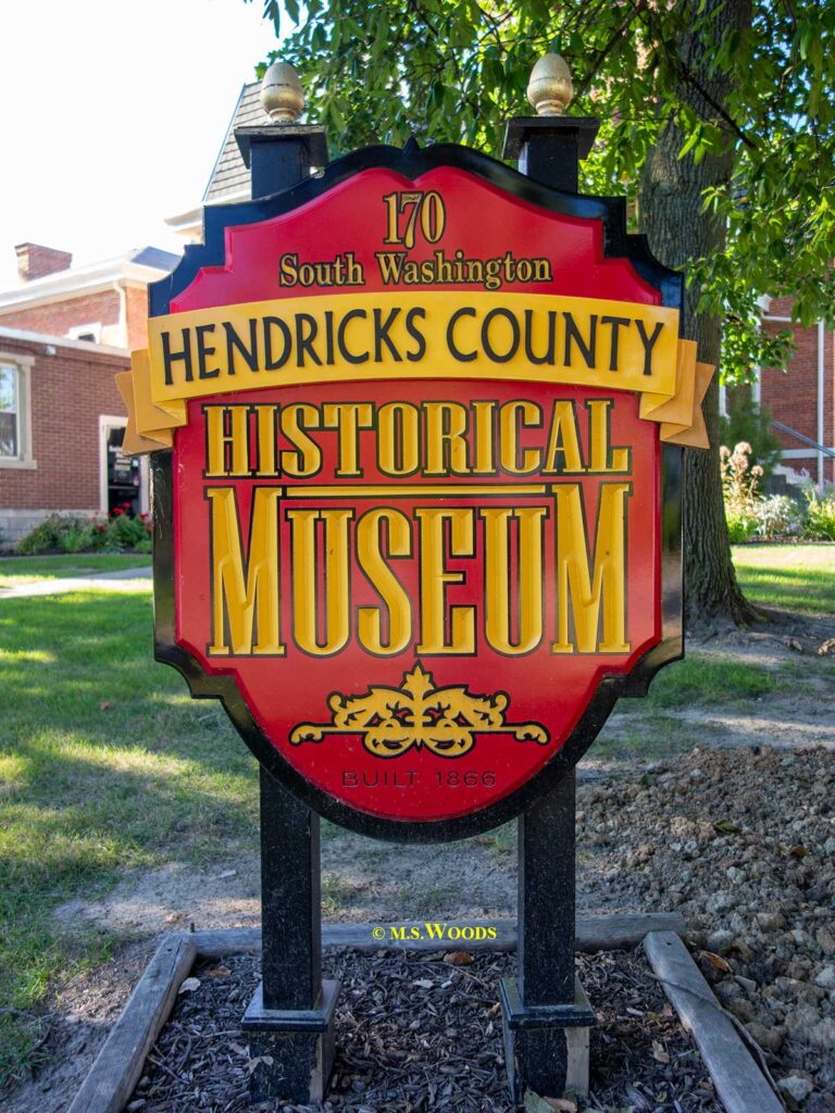 Read and yellow sign for the Hendricks County Historical Museum in Danville, Indiana