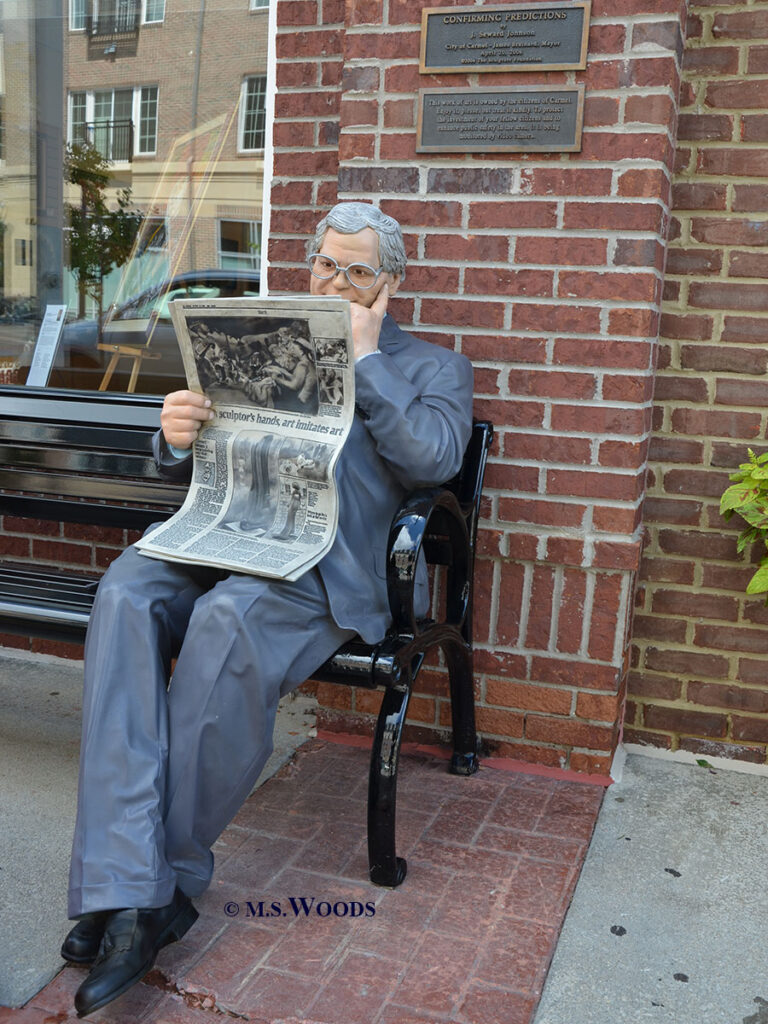 Statue of a man reading a newspaper in Carmel, Indiana