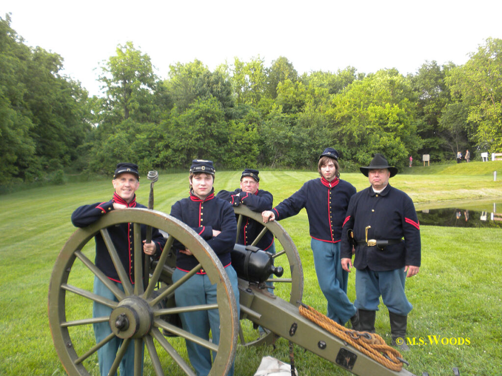 Soldiers standing around a cannon at Conner Prairie in Fishers, Indiana