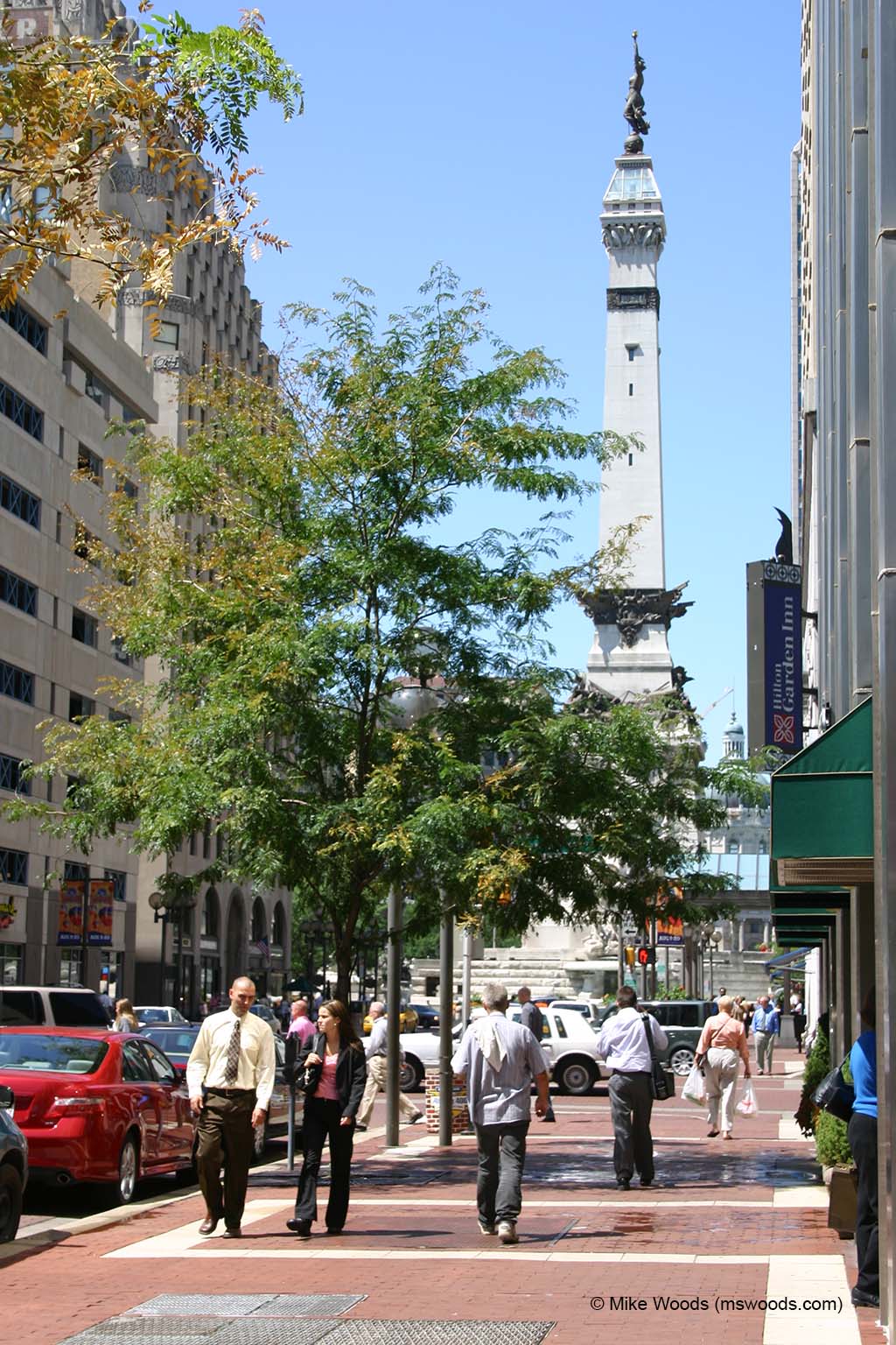 Street view of a busy sidewalk in front of the Soldiers & Sailors Monument in downtown Indianapolis, Indiana