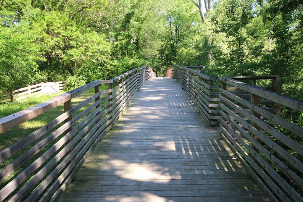 Wooden bridge on the walking trail at Turkey Foot Park in Zionsville, Indiana
