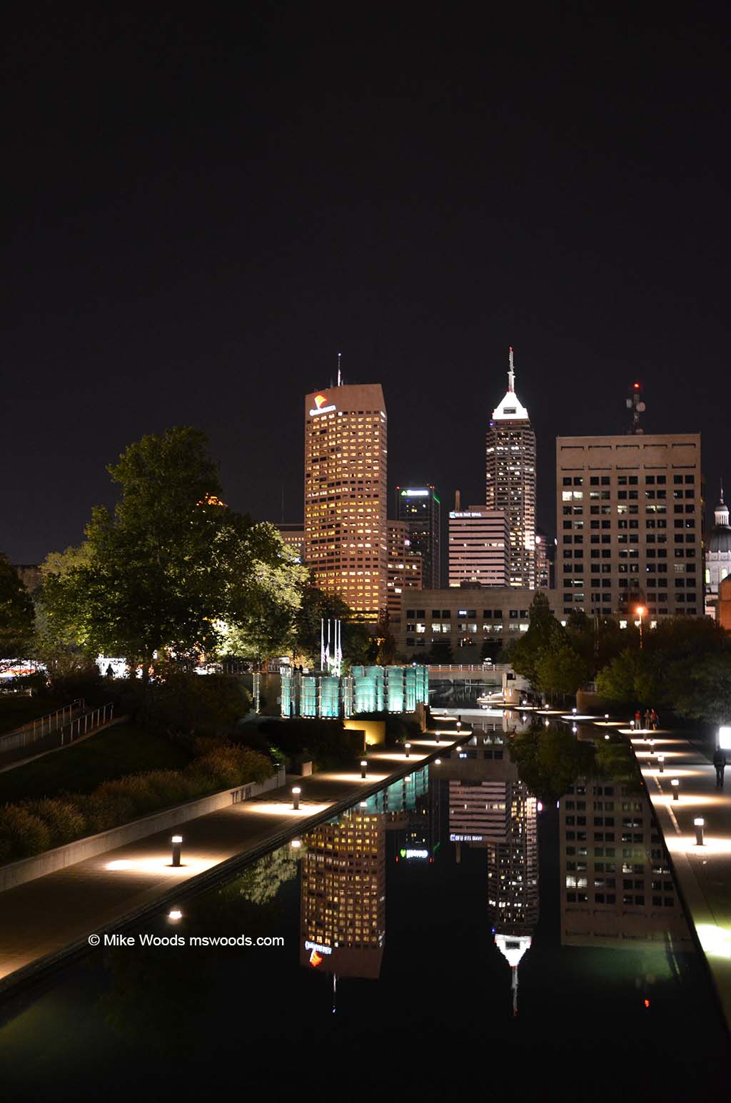 City lights at night from the Canal Walk in White River State Park in downtown Indianapolis, Indiana
