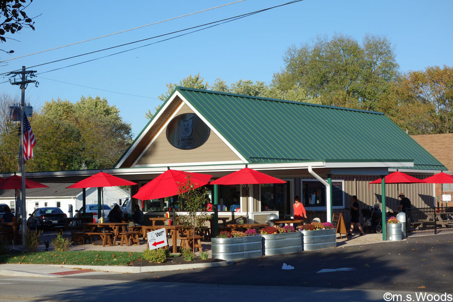 Red umbrellas and outdoor tables at The Mug Restaurant in Greenfield Indiana